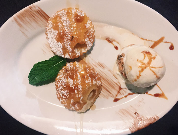 Seadas con Gelato, the last course of the Sardinian tasting menu. Exclusively from Sardegna, puff pastry filled with sweet cheese, lightly fried and served with homemade ice cream. 