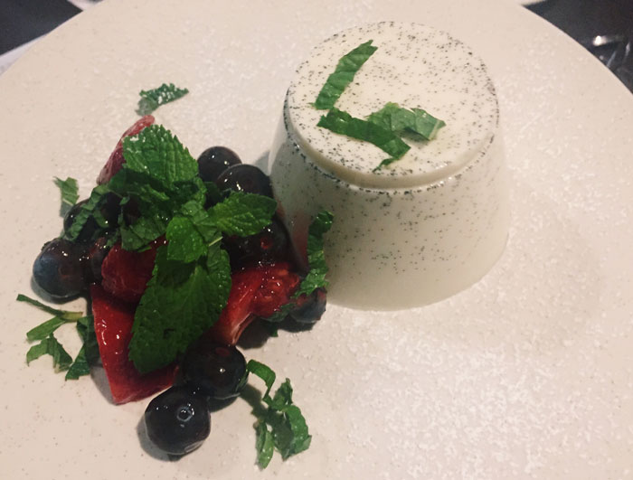 The Pannacotta alla Frutta serves as the dessert for Arcodoro's vegetarian menu. It is a traditional custard finished with raspberries and Saba. 