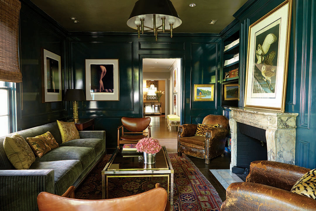 The library’s peacock lacquered walls and ceiling were hand-painted by Barry A. Martin Painting Contractors. The 1948 Finn Juhl chairs in walnut and new saddle leather belonged to the husband’s parents in New Orleans. The distressed vintage leather club chairs were restored by Marcelena Racatune of Larru Leathers. The Barn Owls is an original John James Audubon painting purchased at a Louisiana plantation estate sale. Photographs of Japanese fetish dolls by David Levinthal.