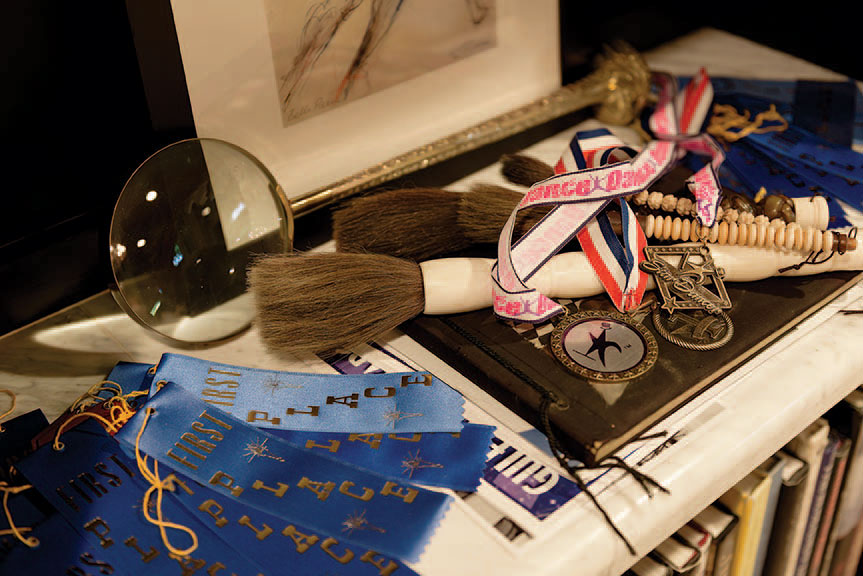 Blue ribbons and metals from Parker’s dance competitions.