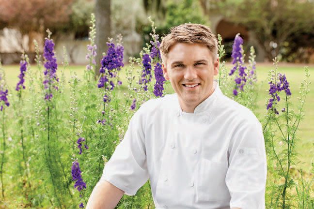 Chef Cory Untch in the herb garden.