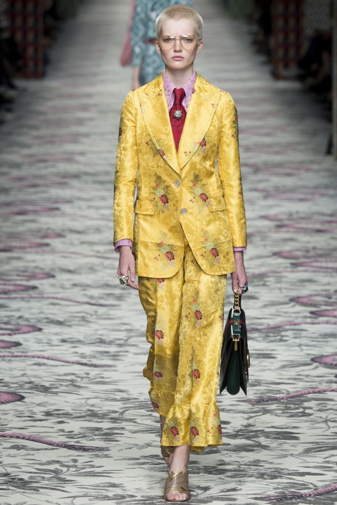This bright suit designed by Gucci is composed of different textures and patterns, which are often seen in Peter Max's designs.