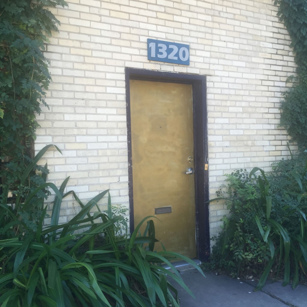 The modest entrance of Cardoza Fine Art gives no hint of its unique creative history or the presence of a rumored ghostly visitor. (Photo by Matthew Ramirez)