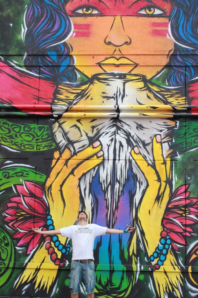 FPLO with his enormous, colorful mural. (1513 St. Emanuel)