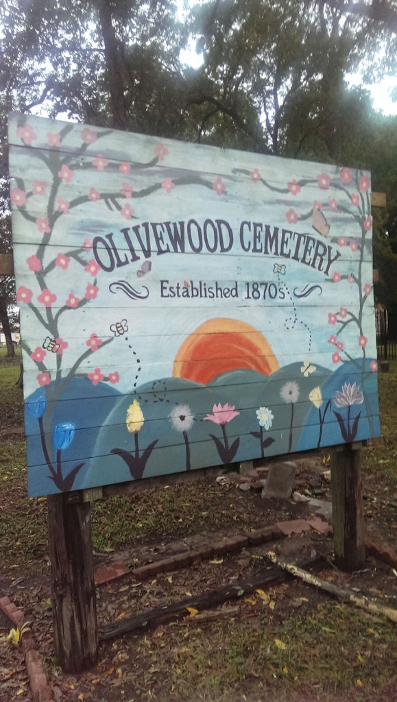 A welcome sign at Olivewood Cemetery, as restored by YES Prep Southeast students class of 2013. (Photo by Matthew Ramirez)