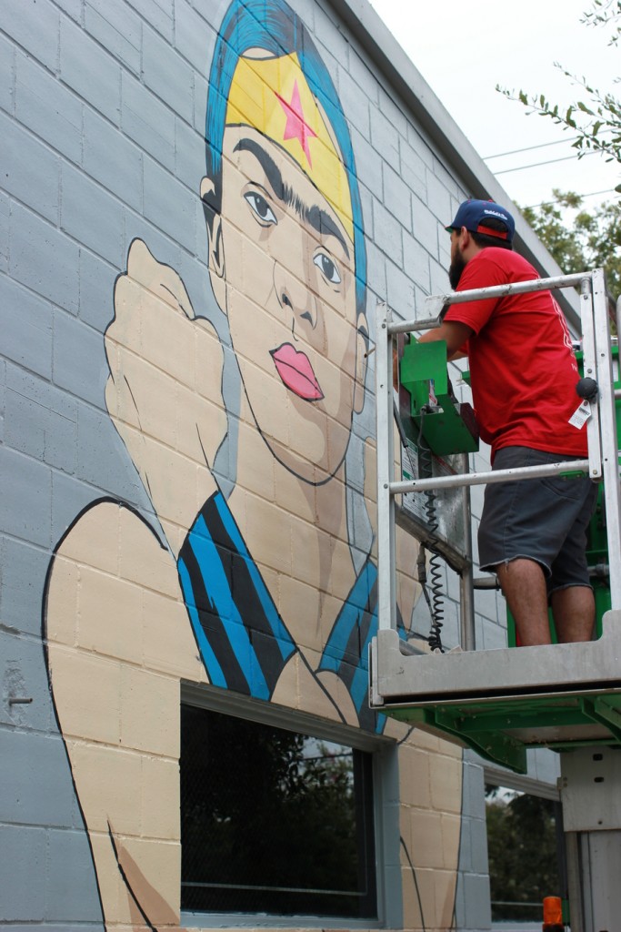 Donkeeboy working on his portrait of Frida Kahlo. (300 N. York St.)