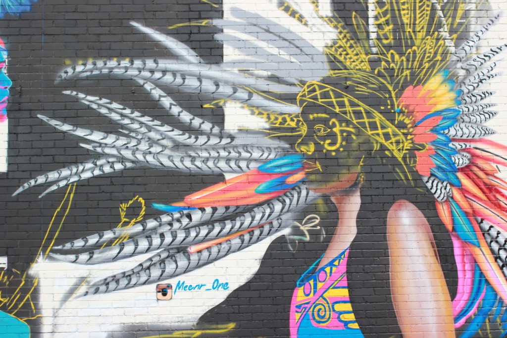 MEENR's mural features fluid, colorful feathers. (6697 Capitol)