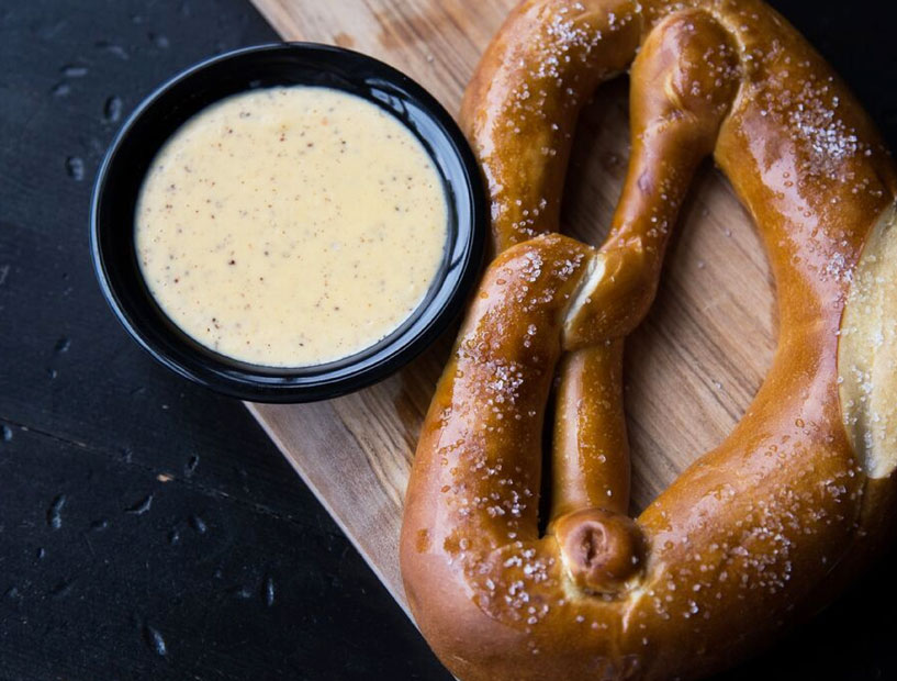 The homemade salted pretzel at Stone's Throw is served with mustard and cheese. (Photo courtesy Stone's Throw) 