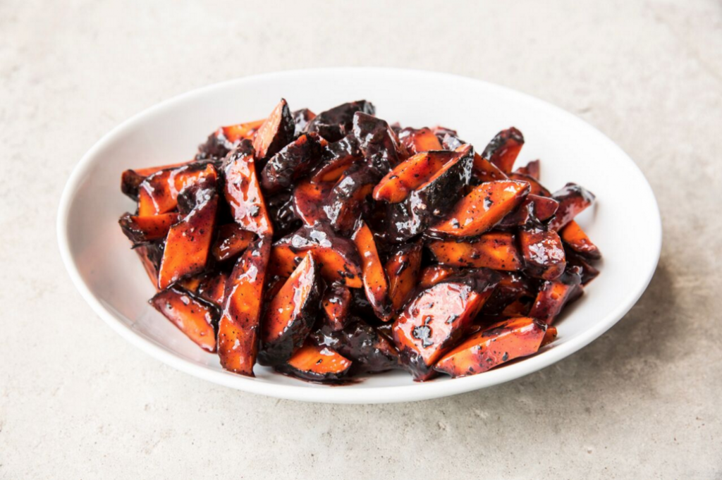 Sides like these sorghum glazed charred carrots are just a click away with Underbelly's online ordering system. (Photo by Julie Soefer)