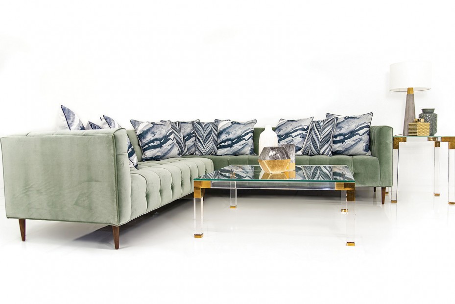 ModShop Delano sectional in sage Como velvet, $5,195; Trousdale coffee table, $1,495; Trousdale side table, $995.