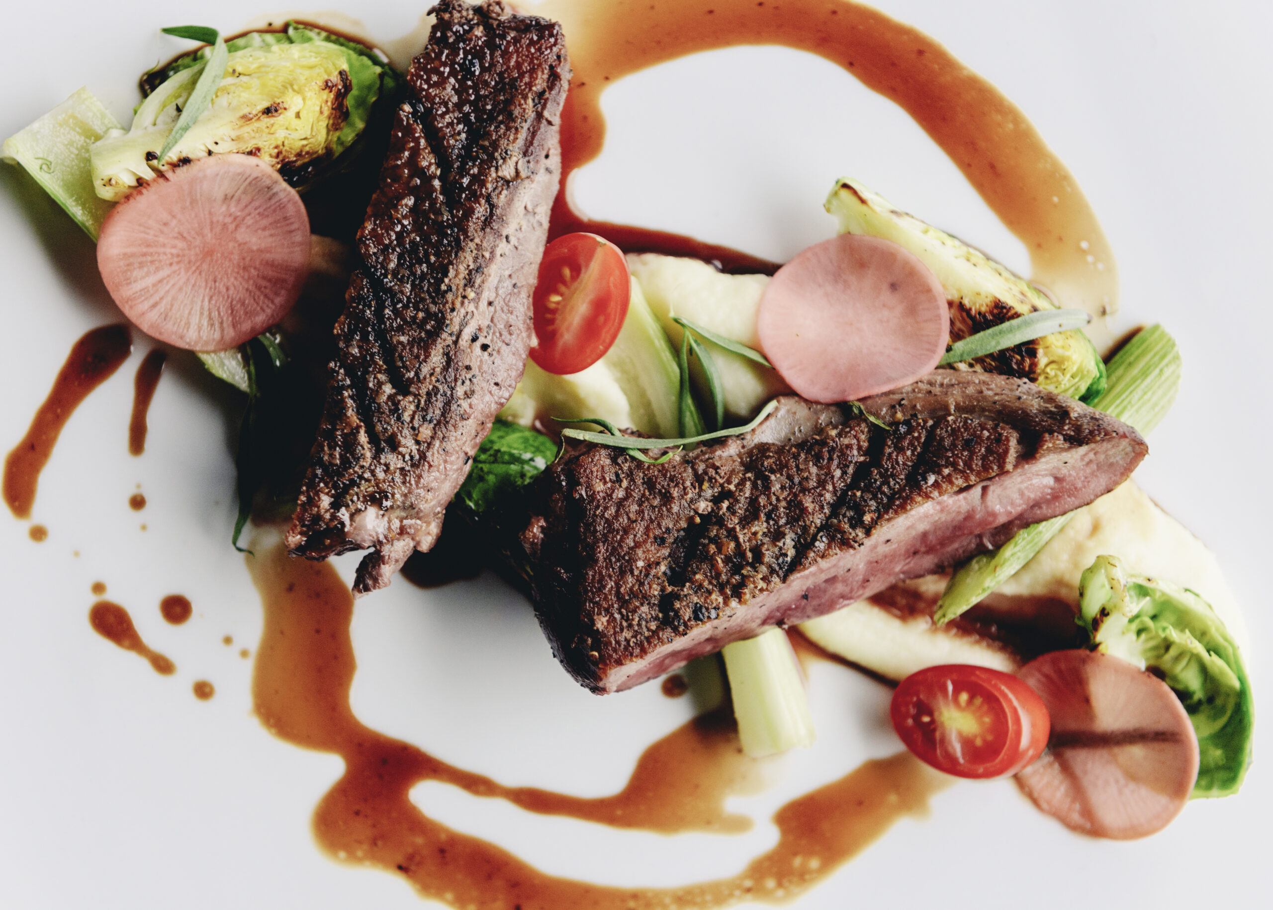 Seared Muscovy duck breast served with parsnips, seasonal vegetables and demi-glace serves as a new item on The Durham House's dinner menu.