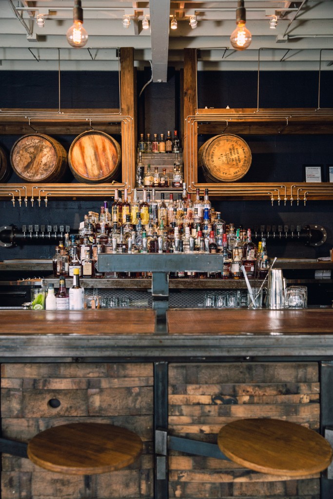 Bourbon barrels from distilleries in Kentucky and Colorado line the walls at Eight Row Flint.