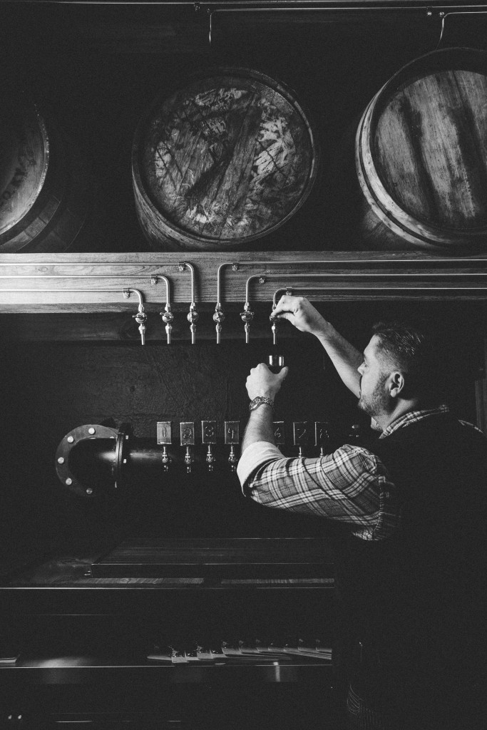 Custom-made spouts are connected to the bourbon barrels, allowing direct pouring. 