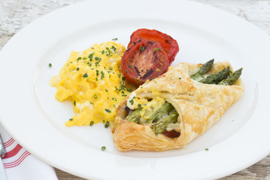 B&B Scramble — crème fraiche, roasted tomato, ham and swiss chees, served with an asparagus bundle
