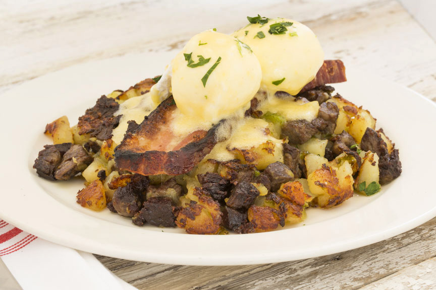 B&B Hash — prime rib and hash browns topped with house smoked beef bacon, poached eggs & hollandaise sauce