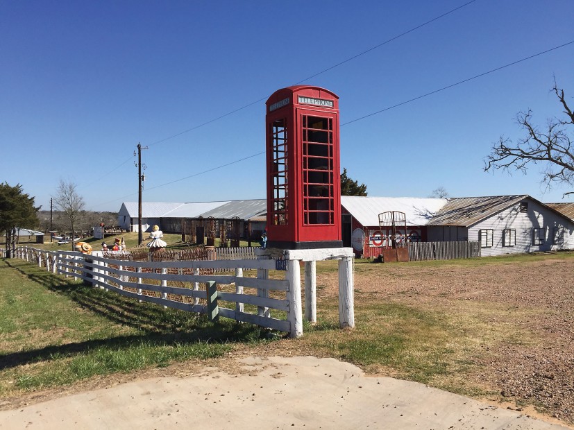 This British phone booth on top of a white fence has caused more than a few triple takes on the highway.