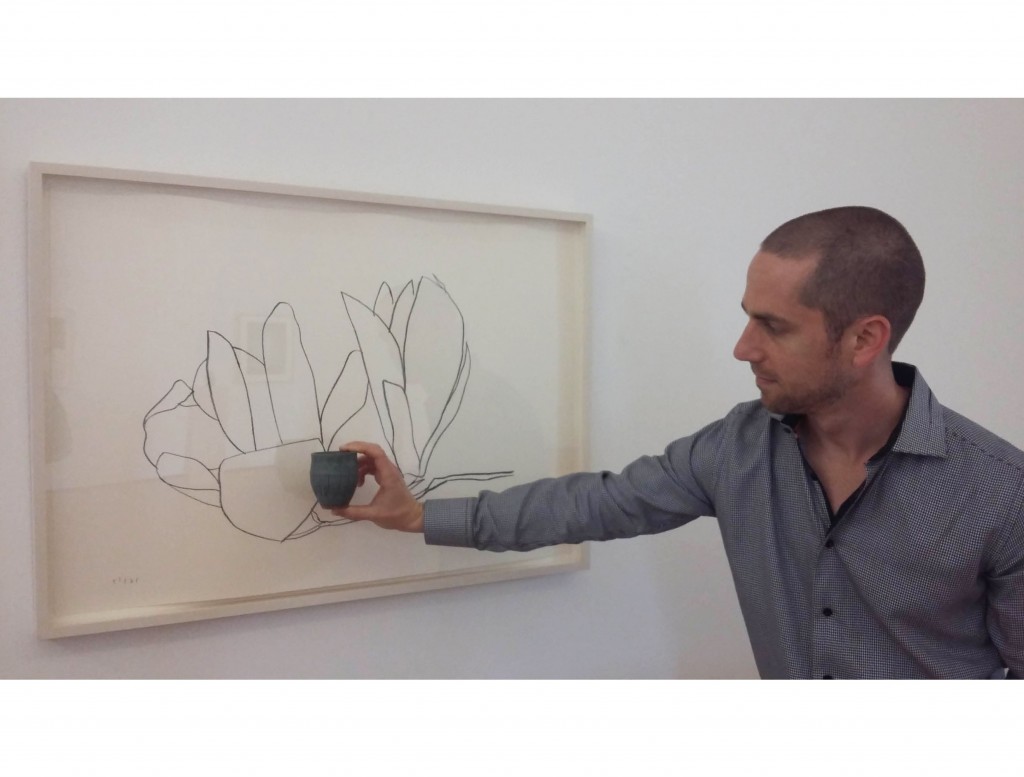 Gallery director Josh Pazda with a work on paper by Willem de Kooning and its counterpoint, a Janet Leach ceramic vessel, both offering an ode to nature.