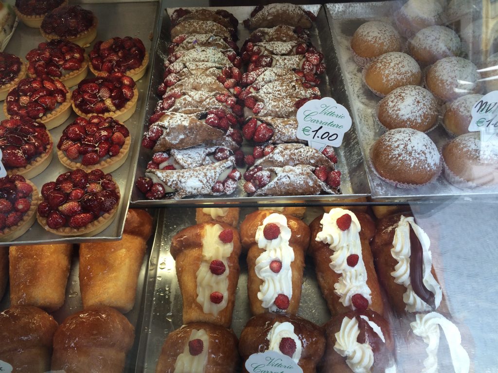Pastries to love; sfogliatella frolla, rum baba, and cannoli. 
