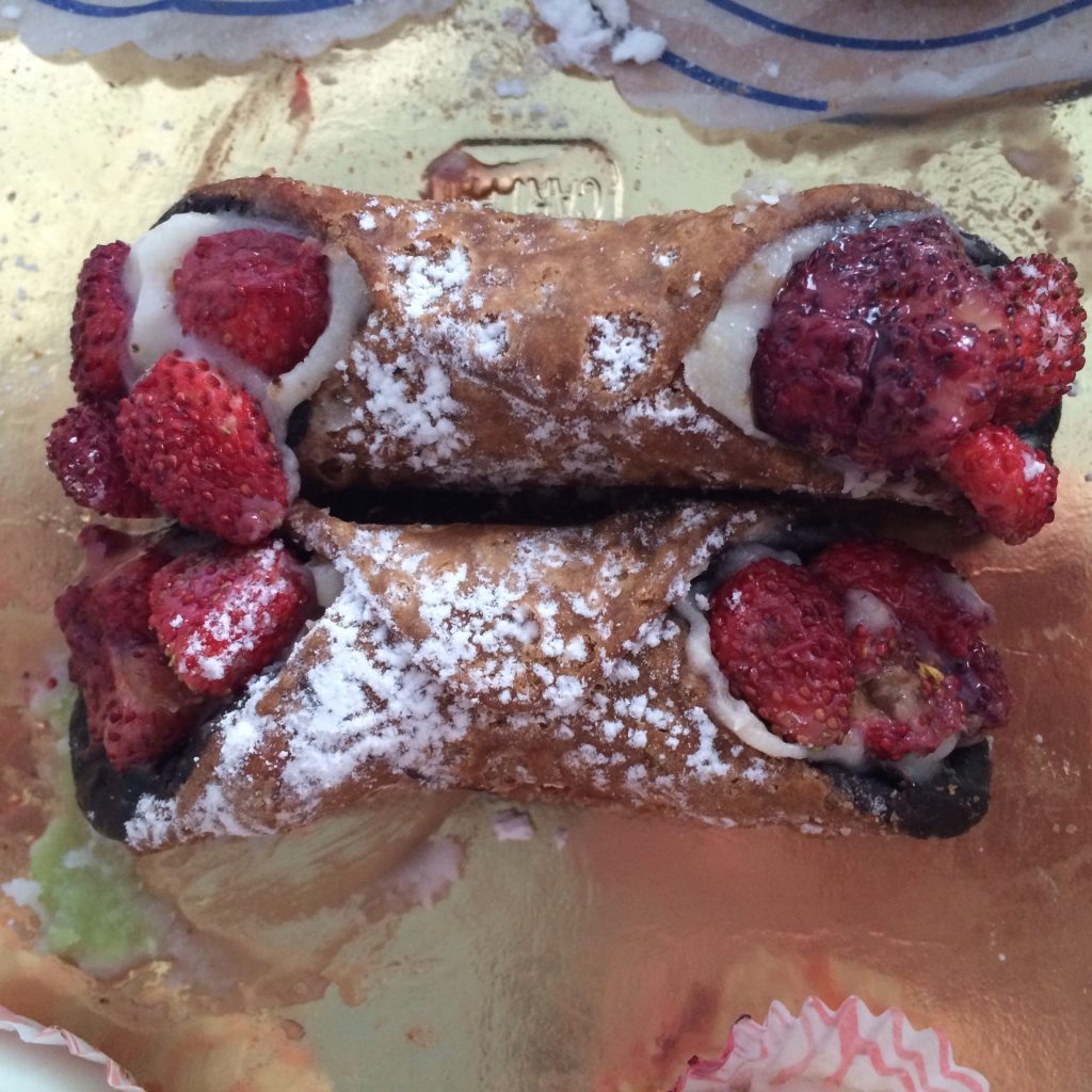 Sweet treat; cannoli with wild strawberries.