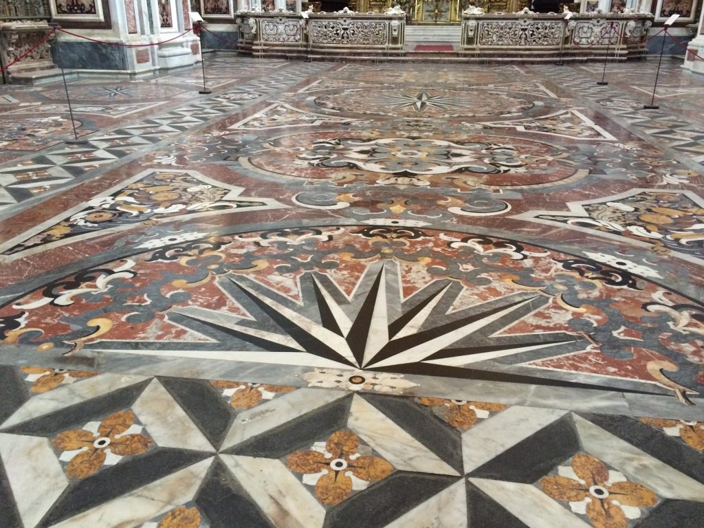 Exquisite marble patterned floor in the church at San Martino.