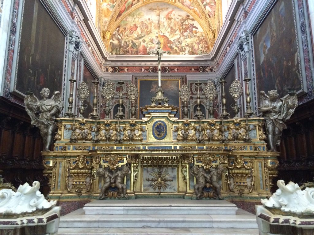 Orante altar at San Martino surrounded by extravagant canvases and frescoes. 