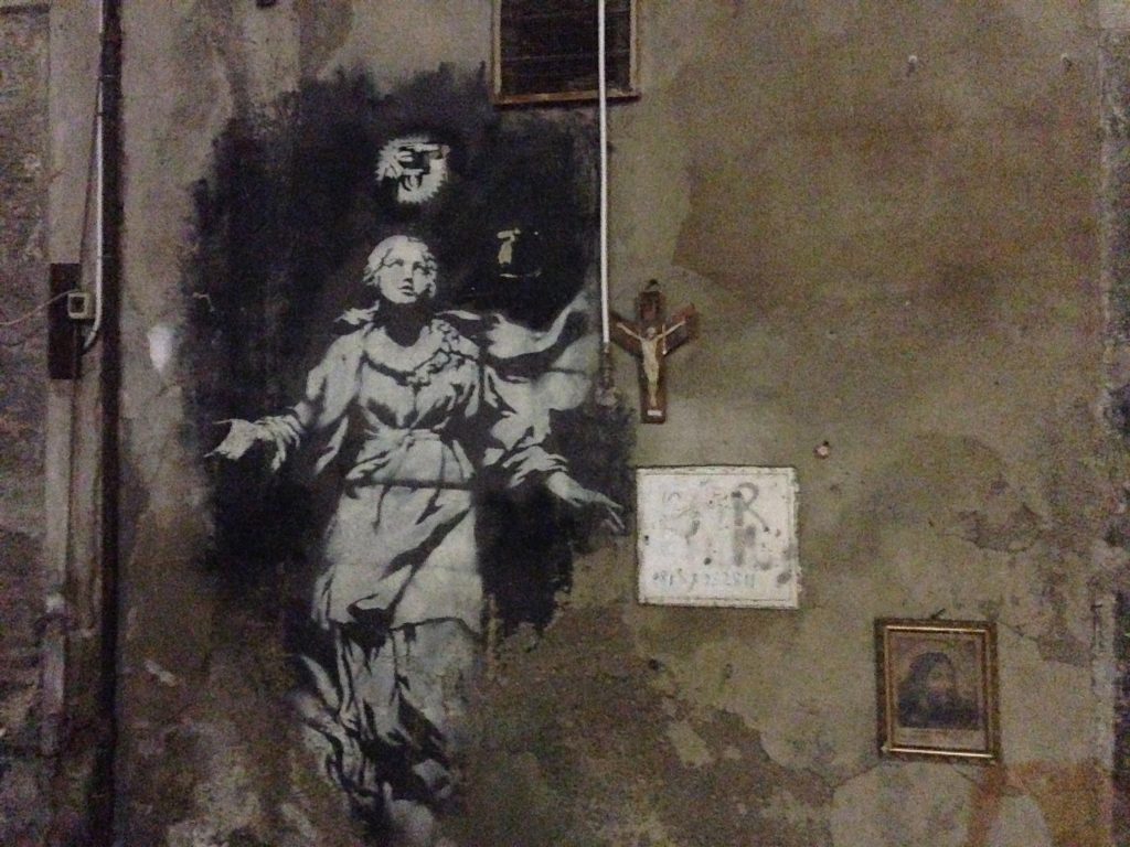 Banksy angel on Spaccanoapoli, 2013.