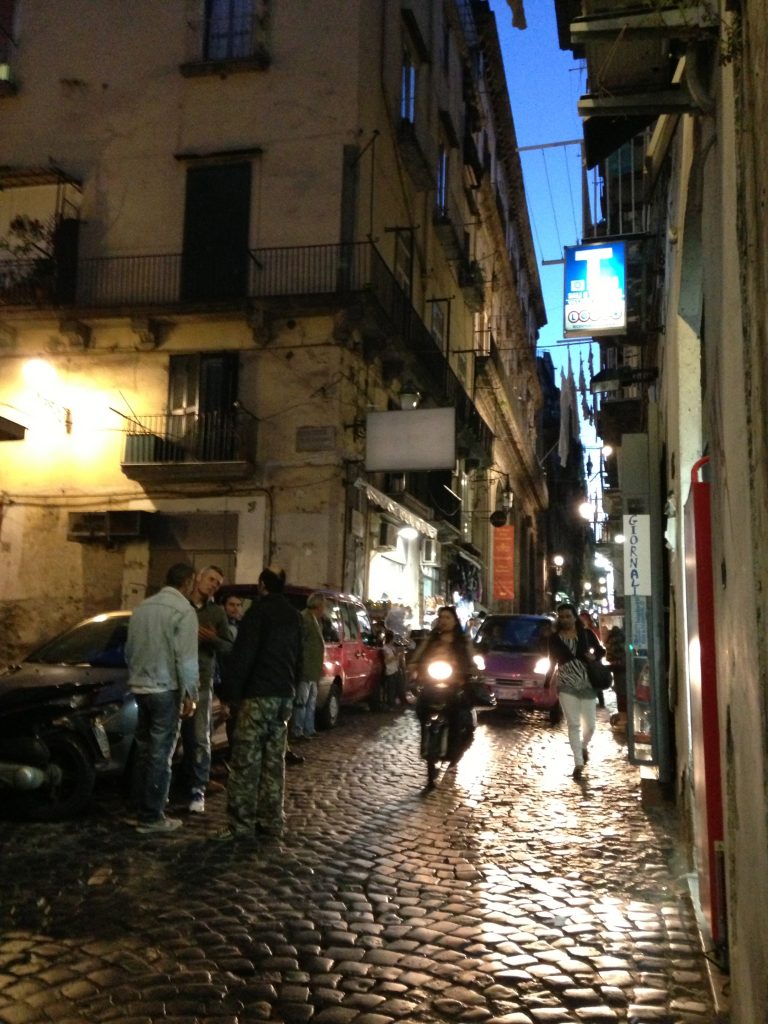 Vibrant Spaccanapoli at night.