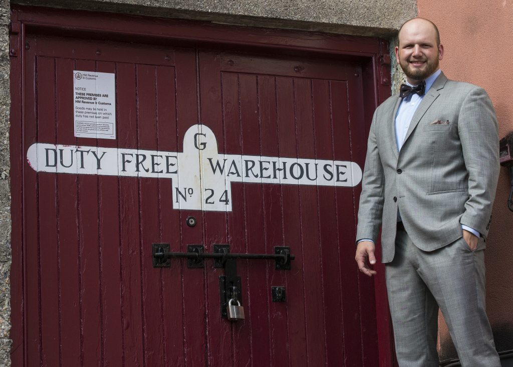 Jonathan Wingo and a storied door in Scotland. (Courtesy The Balvenie)