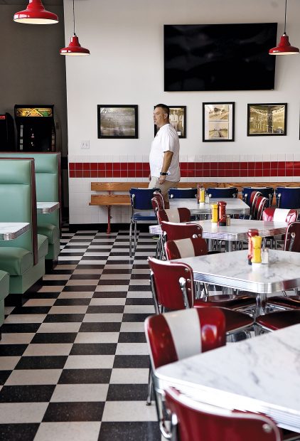 Owner Ronnie Killen surveys the scene in his Killen's Burgers.