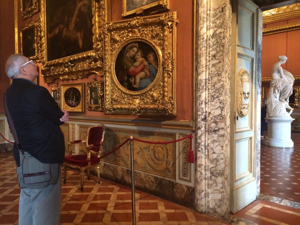 Earl in awe of Raphael's Madonna of the Chair in the Sala di Saturno gallery in Palazzo Pitti.