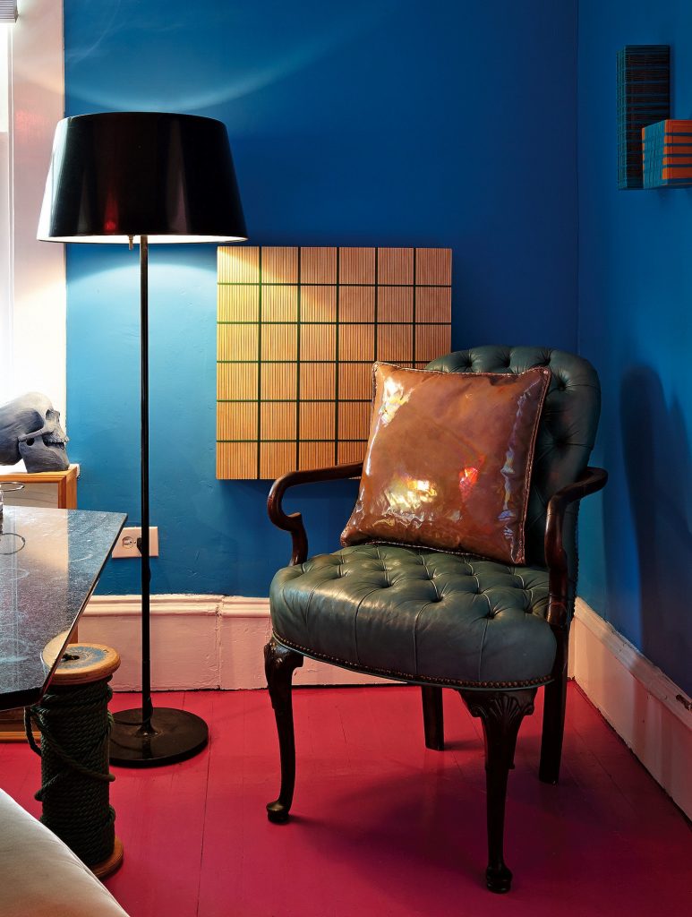 Vintage chair with Dan & Joseph patent-leather pillow, $175. Gina Garza artwork, $1,800.