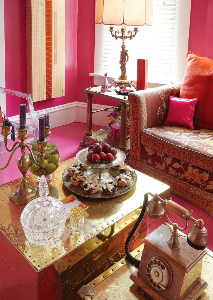 In the living room, the brass trunks were vintage market finds. Vintage onyx and 14K-gold-plated Italian telephone belonged to Steffen's grandmother.