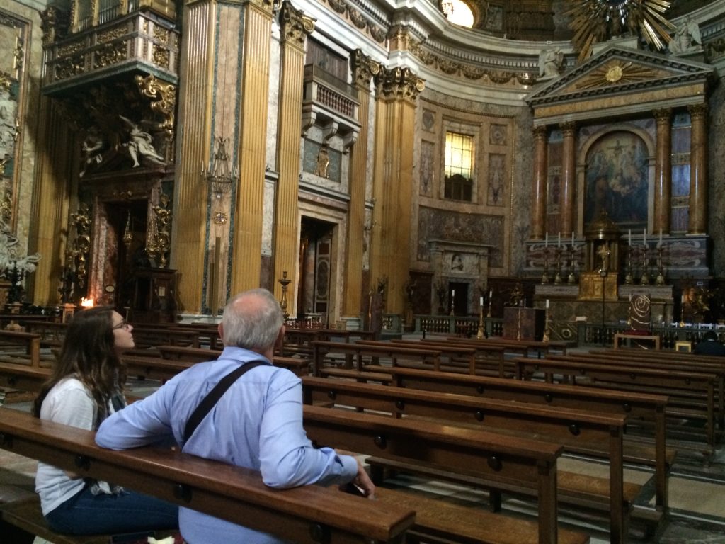 Earl and his granddaughter Arianne survey the high altar at The Gesu. 