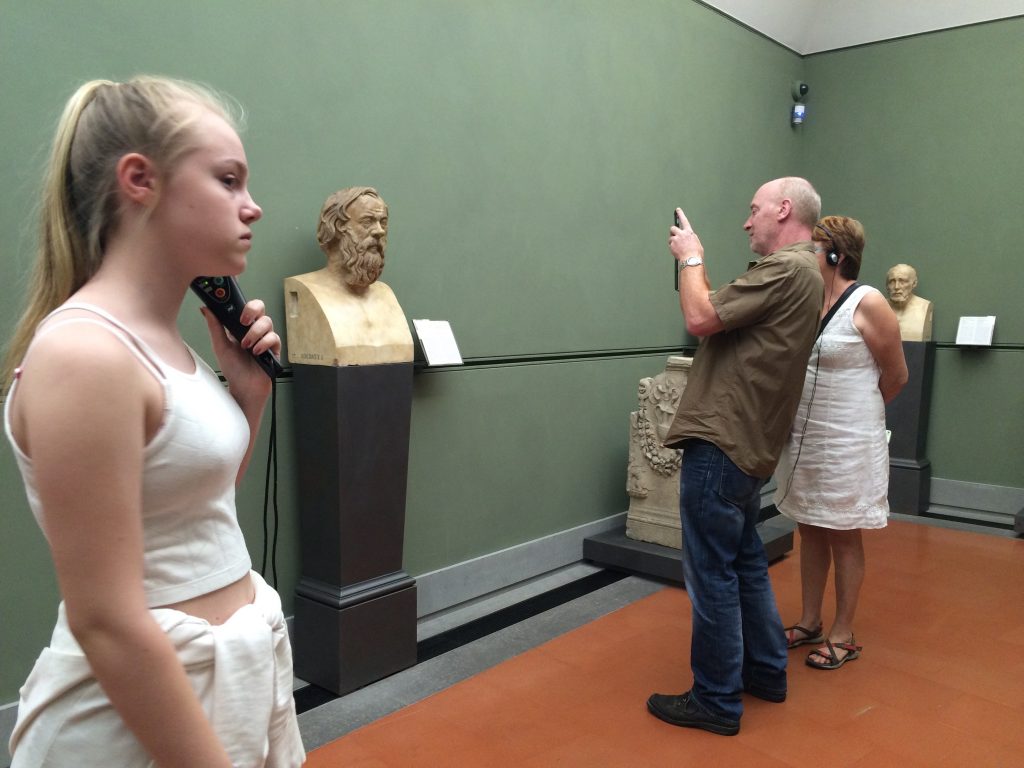 Gallery in the Uffizi. I liked the juxtoposition of tourists and marble bust.