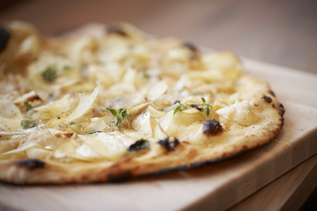 Provisions wood-fired pizza will be served alongside Shake Shack favorites. 