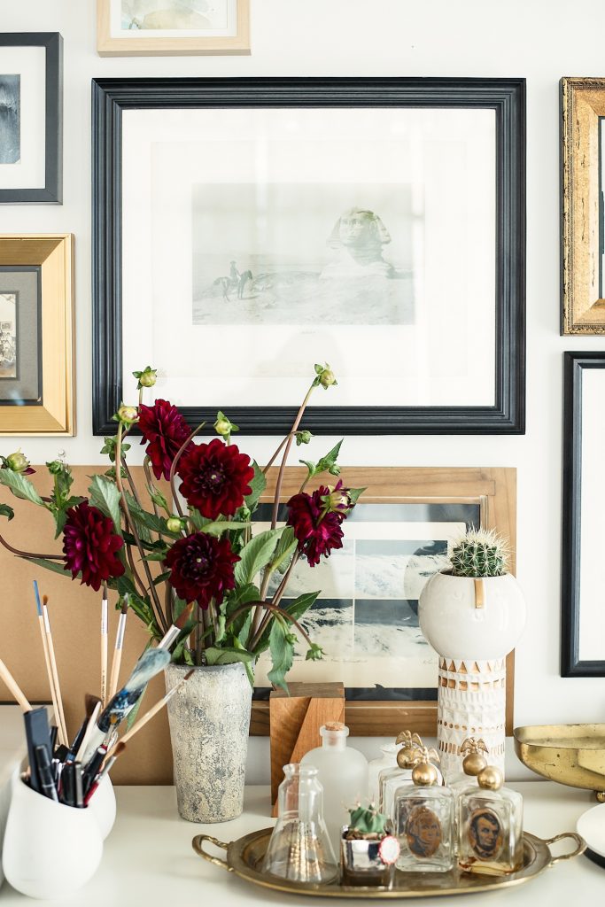 Objects, vintage art, materials, and tools in the studio