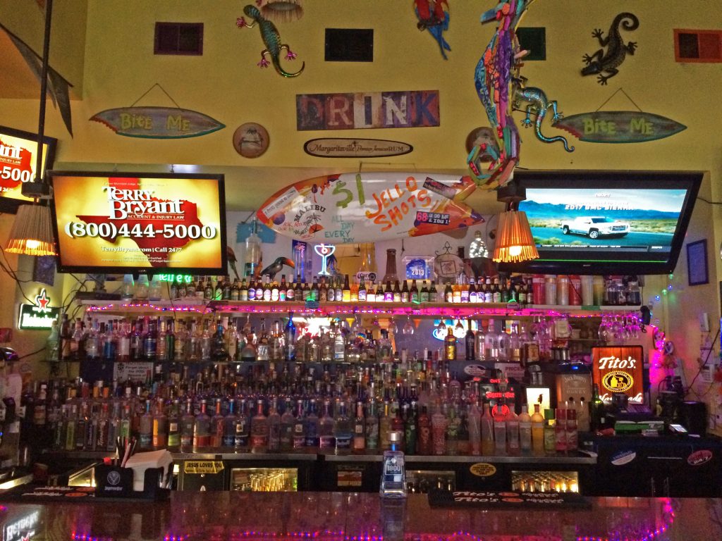 The bar is stocked with a multitude of spirits, including a wide variety of flavored liquor.