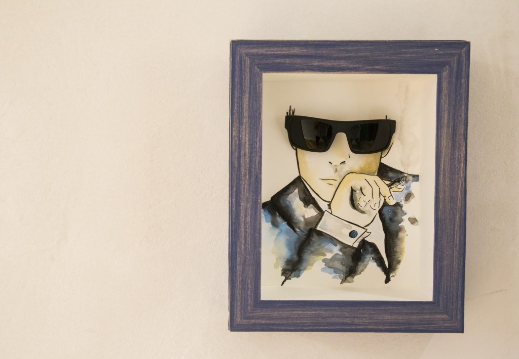 Another sketch of Butler's hangs next to the men's bathroom