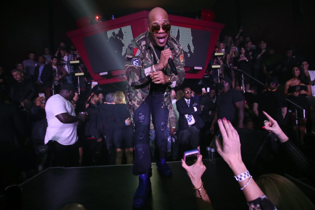 HOUSTON, TX - FEBRUARY 04:  Recording artist Flo Rida performs onstage during the Playboy party with TAO Group at Spire Nightclub on February 4, 2017 in Houston, Texas.  (Photo by Christopher Polk/Getty Images for Playboy)