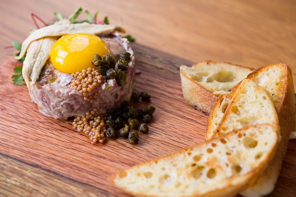 Don't miss chef Chris Loftis' take on steak tartare at The Pearl. 