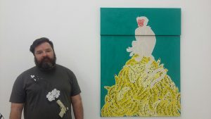 Design District dealer Brian Gibb with a canvas by Manik Raj Nakra.