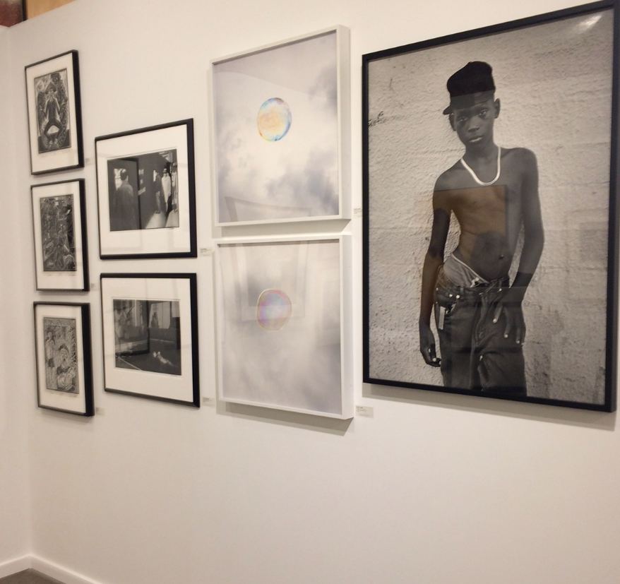 Dallas-based PDNB Gallery returned to the Fair after a hiatus of five years, and reported keen response its photo platform. On the right, Earlier Hudnall Jr.'s "Hip Hop" is on hold for a Texas museum.