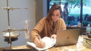 Art royal Hannah Hoffman brought her L.A. gallery to the Fair for the first time. Here she does brisk business from a desk by Elaine Cameron-Weir, which includes burning frankincense.