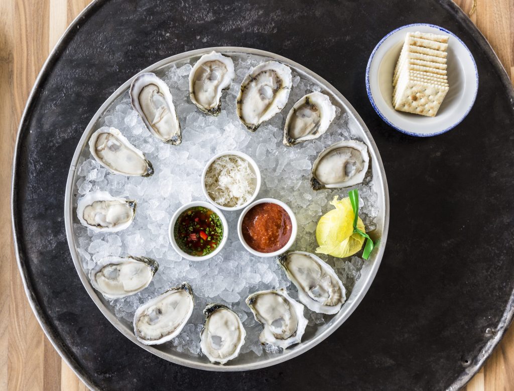 Get your oysters fix at Star Fish's happy hour. (Photo by Julie Soefer)