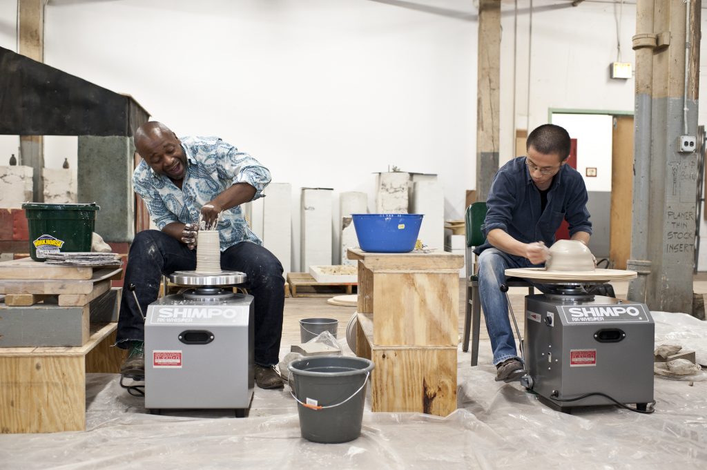 Theaster Gates and Kouichi Ohara with Gates' "Soul Manufacturing Corporation" (Photo courtesy Ginger White Photography and White Cube Gallery)