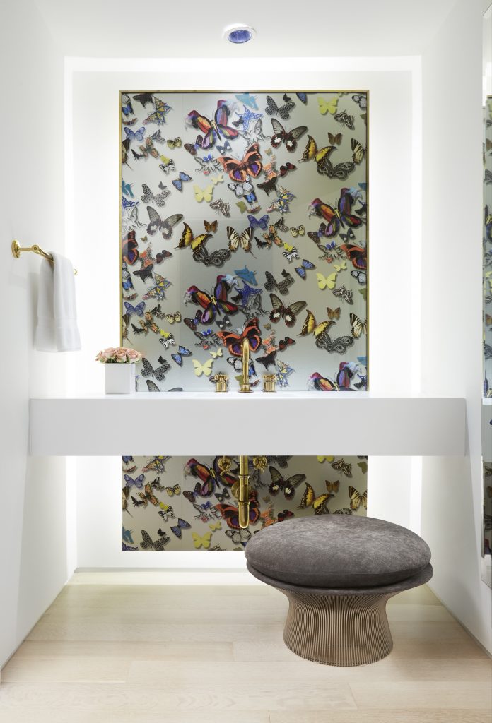 In the powder bath, Christian Lacroix Butterfly Parade wallpaper. William Platner stool for Knoll, from Scott + Cooner. (photo by Lisa Petrole)