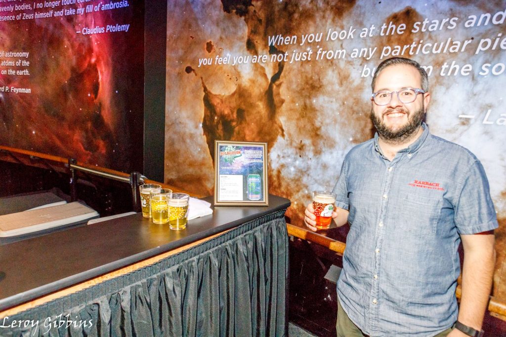 Karbach Brand Manager David Graham told people a little bit about Space City as they came up to the bar. (Photo by Leroy Gibbins)