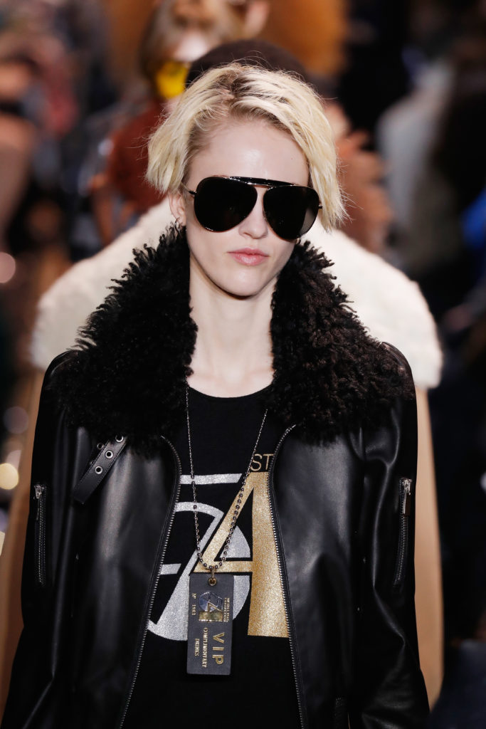 Michael Kors Studio 54 T-shirt, leather jacket with fur collar.  (Photo by JP Yim/Getty Images for Michael Kors)