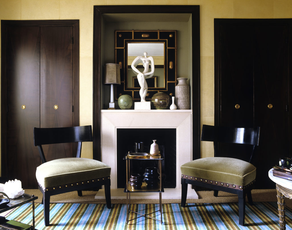 Left Bank pied-à-terre entered though a secret door at the top of four flights of twisted stairs.