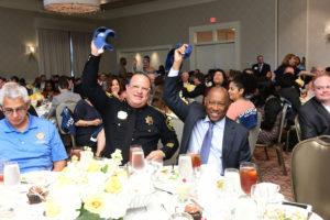 Constable Alan Rosen and Mayor Sylvester Turner waving the rally towels at the Center for Pursuit luncheon. photo by Daniel Ortiz (Photo by Daniel Ortiz)